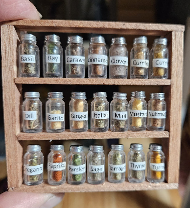 User Image Review Showing a Filled and Labeled Spice Rack with different spices in each jar.