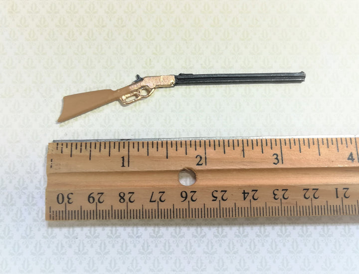 Dollhouse Winchester Rifle measuring 3.5" long (8.8 cm)  Painted metal, brown stock with gold action  by Island Craft Miniatures