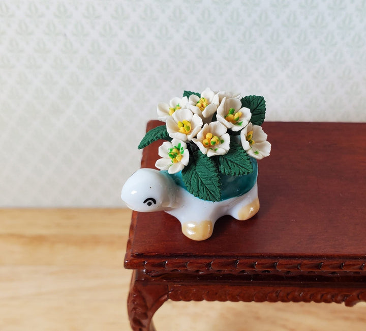 Dollhouse White Flowers in Green Ceramic Turtle Planter Pot 1:12 Scale Miniature - MiniatureCrush