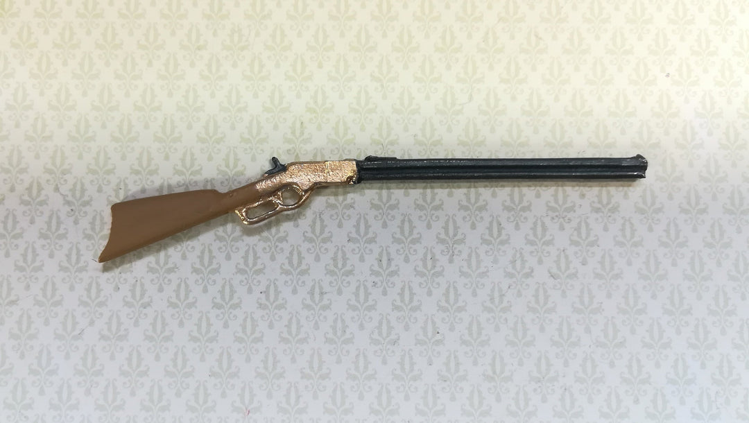 Dollhouse Winchester Rifle measuring 3.5" long (8.8 cm)  Painted metal, brown stock with gold action  by Island Craft Miniatures