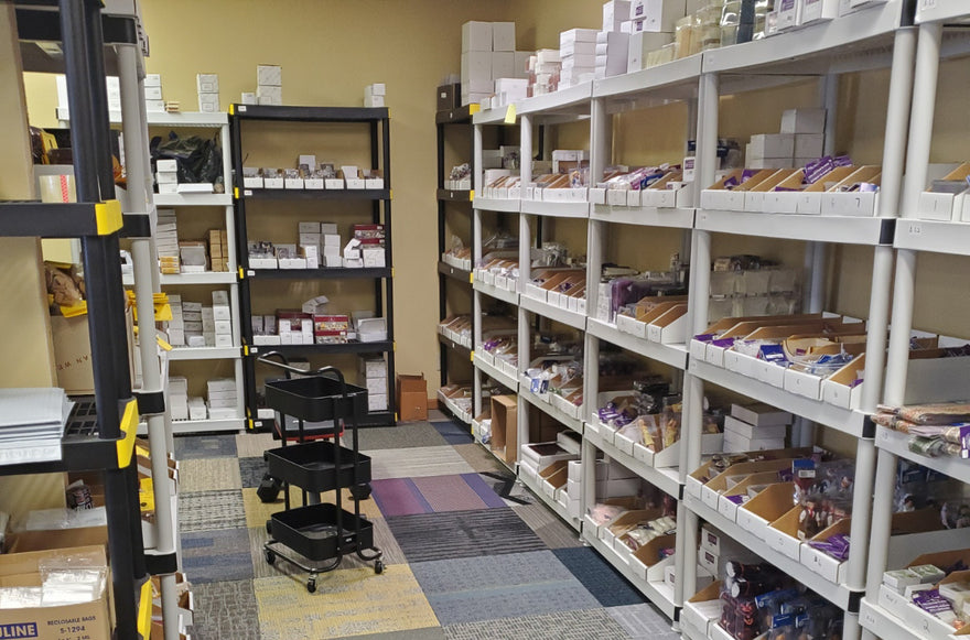 Shelves of miniature inventory in the first office