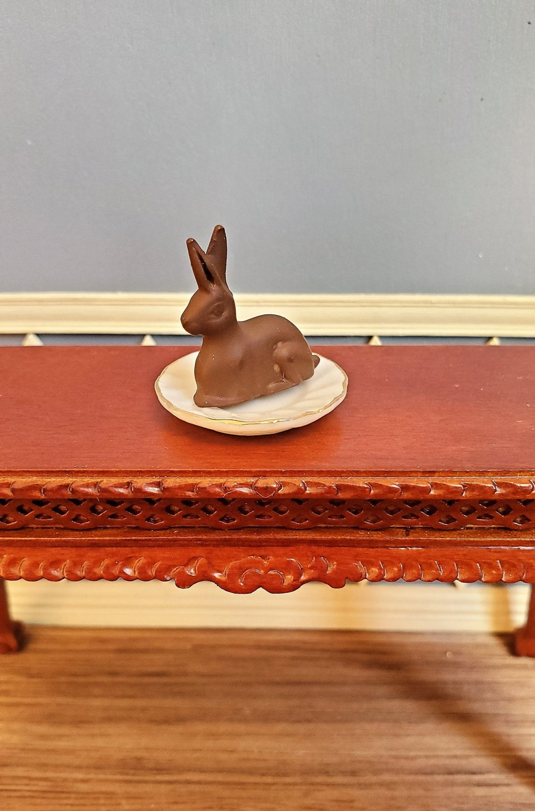 https://miniaturecrush.com/cdn/shop/products/dollhouse-miniature-chocolate-easter-bunny-rabbit-112-scale-34-tall-406886.jpg?v=1686414892&width=1080